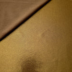 Texture view of Antique Bronze metallic stretch fabric, highlighting foil shimmer and surface detail for performance apparel