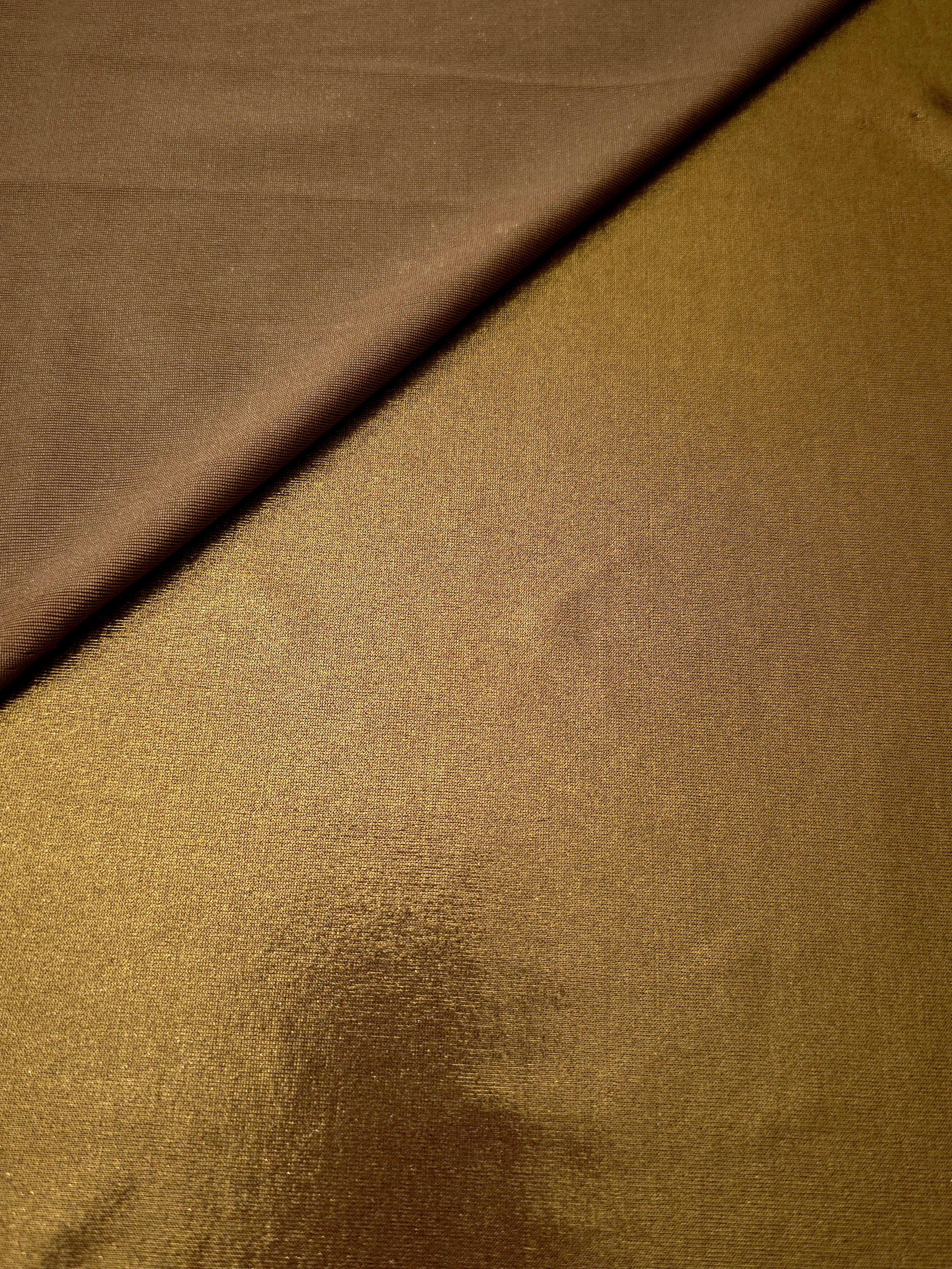 Texture view of Antique Bronze metallic stretch fabric, highlighting foil shimmer and surface detail for performance apparel