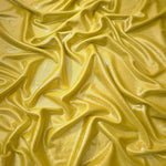 Antique Gold shimmer stretch fabric in draped folds, highlighting metallic foil sheen for evening dresses, costumes and statement apparel