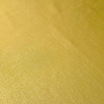 Antique Gold shimmer stretch fabric close-up, revealing metallic foil texture and reflective detail for fashion and costume sewing