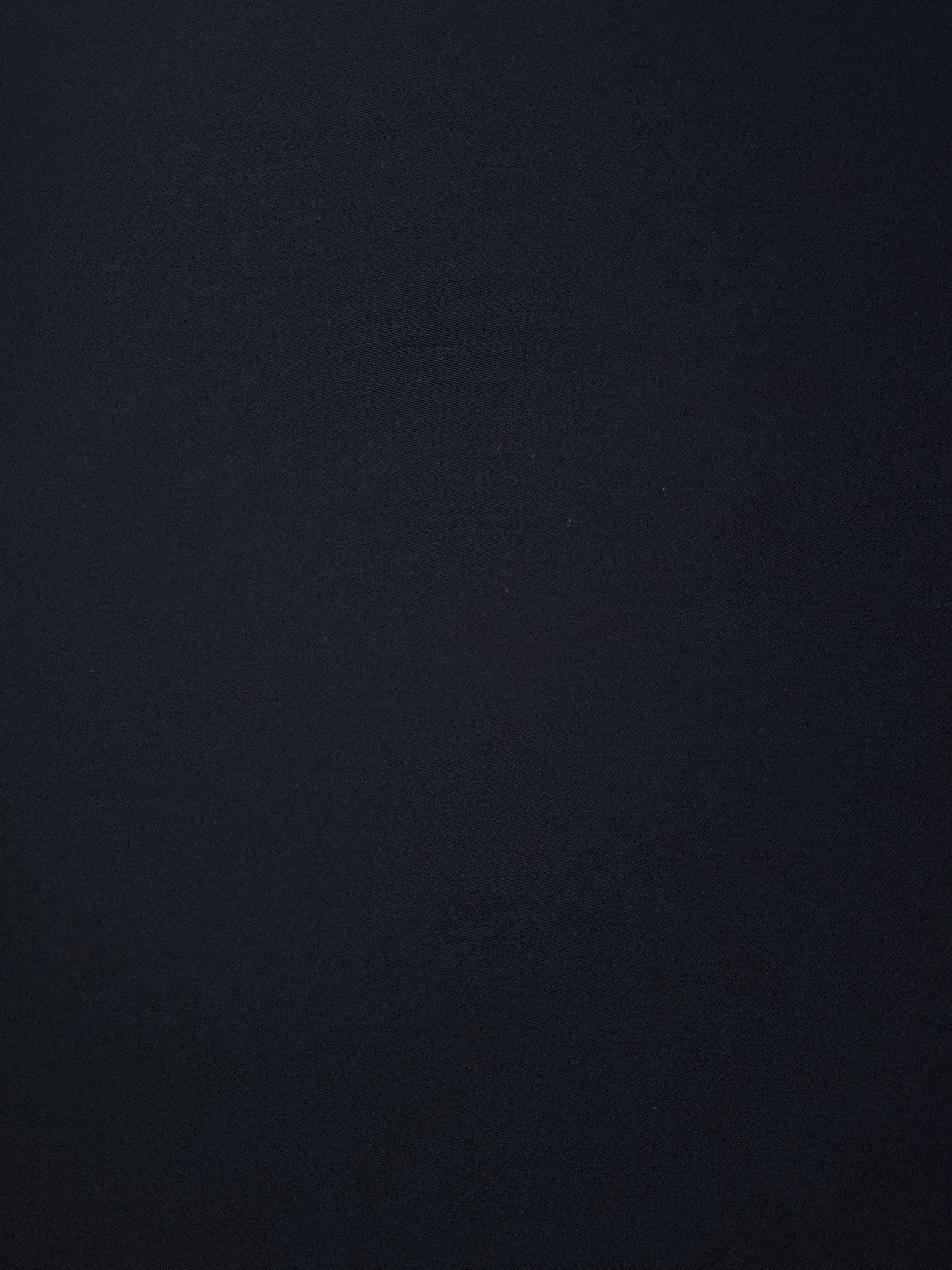 Woven close-up of Blue Black mechanical polyester crepe showing smooth texture and a soft silky-feel finish