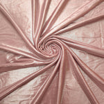 Swirled Blush Champagne metallic foiled spandex showing fluid movement and luminous sheen for dresses, dancewear and stage costumes