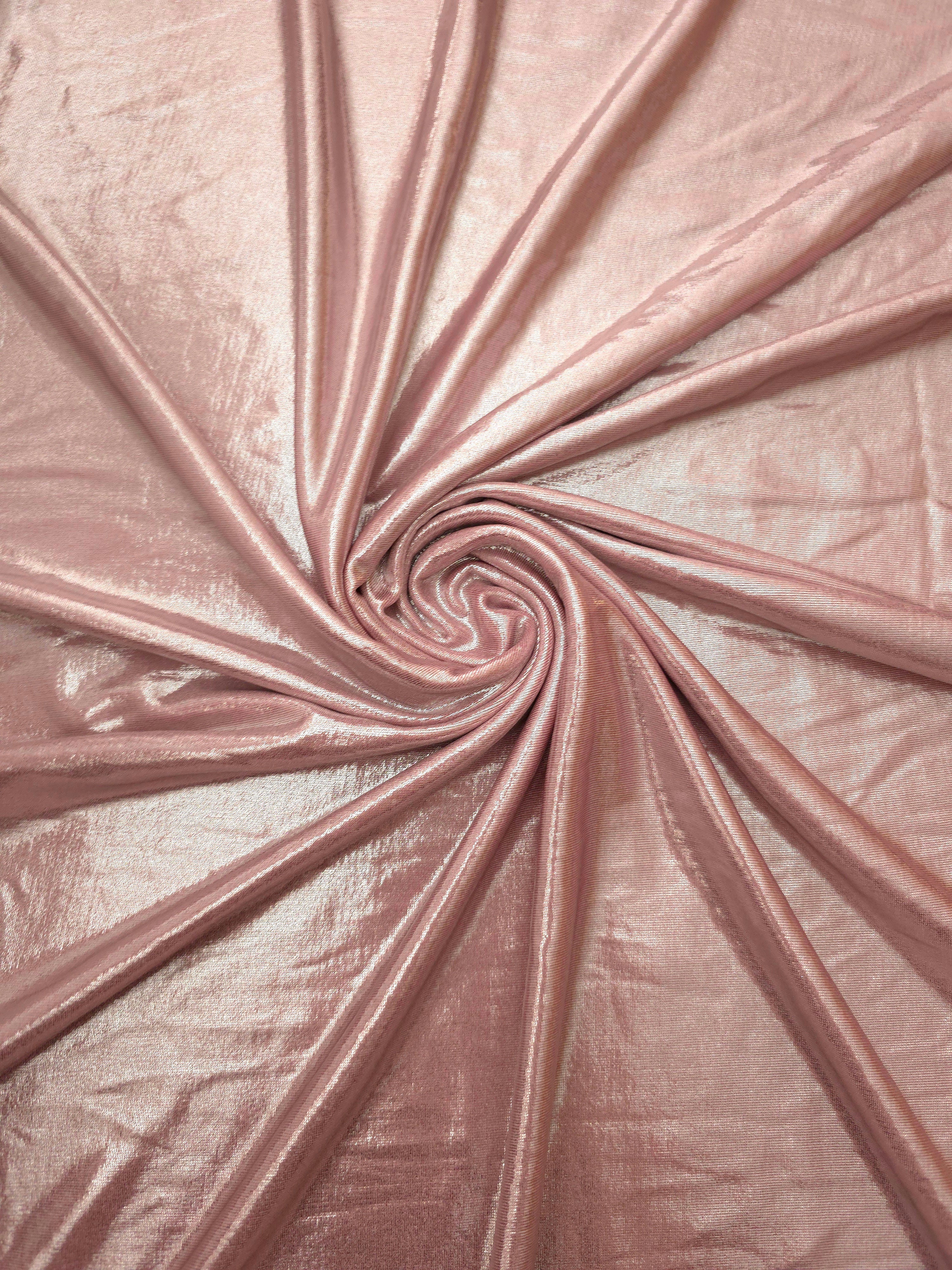 Swirled Blush Champagne metallic foiled spandex showing fluid movement and luminous sheen for dresses, dancewear and stage costumes