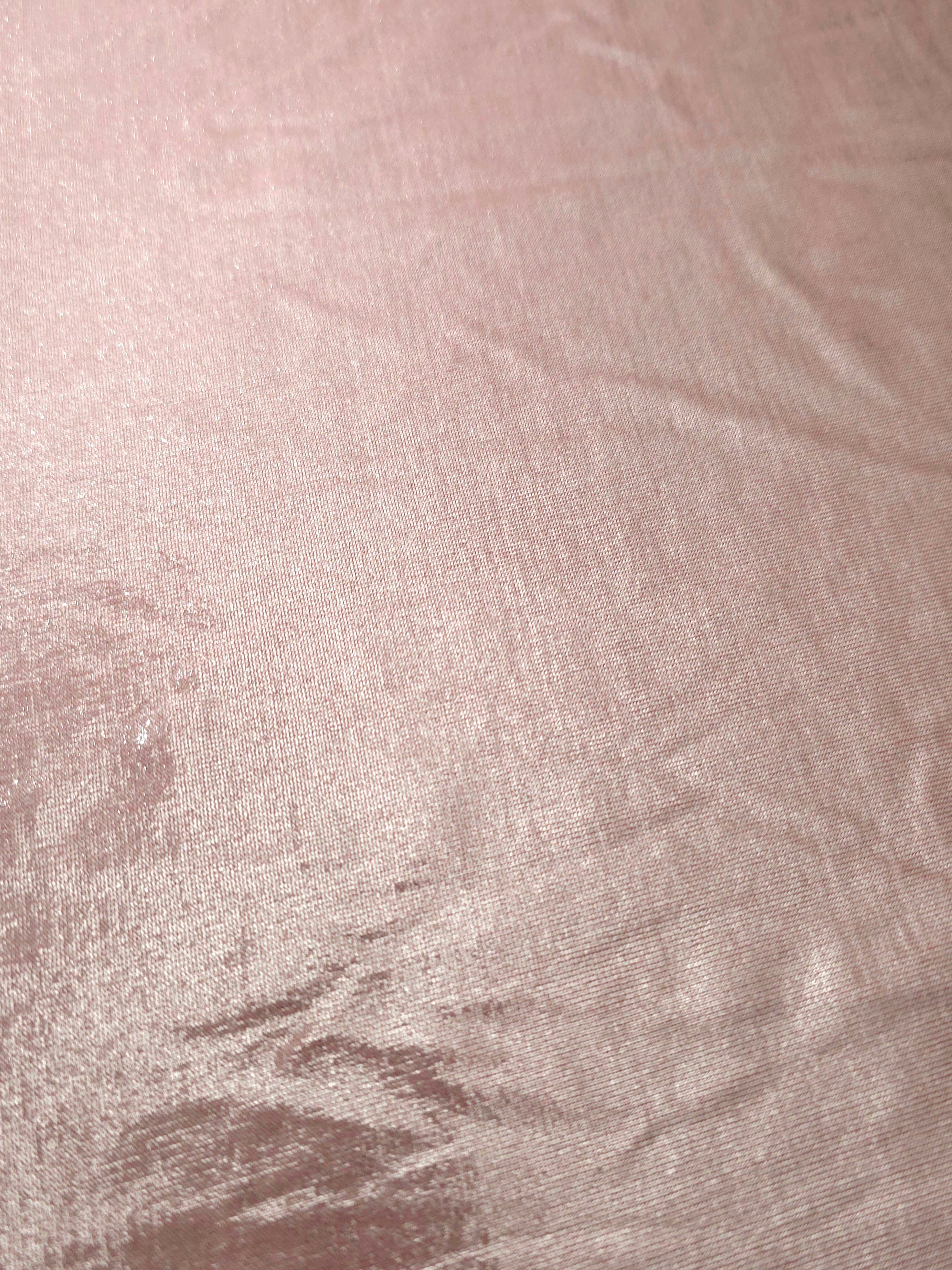 Blush Champagne shimmer stretch fabric close-up, revealing metallic foil texture and reflective detail for fashion and costume sewing