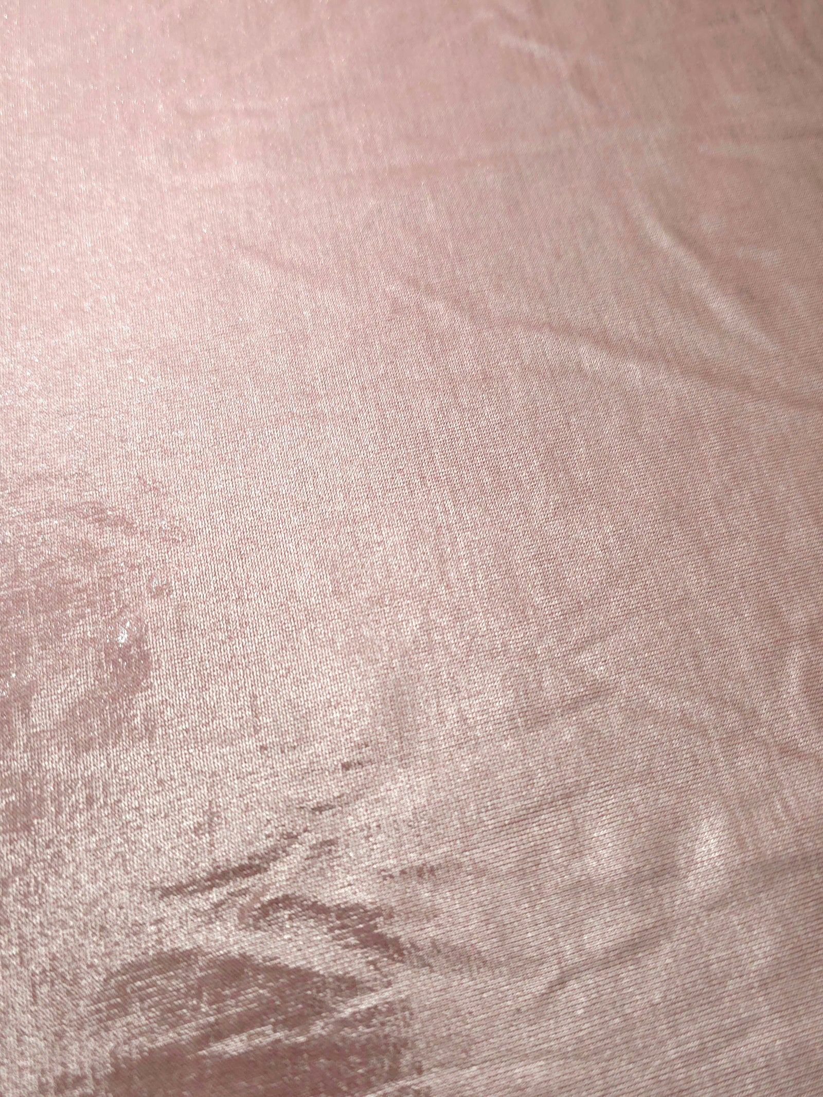 Blush Champagne shimmer stretch fabric close-up, revealing metallic foil texture and reflective detail for fashion and costume sewing