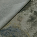Blue botanical shadow linen-look jacquard fabric close-up with raised woven texture and tonal leaf pattern.