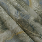 Reverse side of blue botanical shadow jacquard fabric showing woven structure and linen-look texture.
