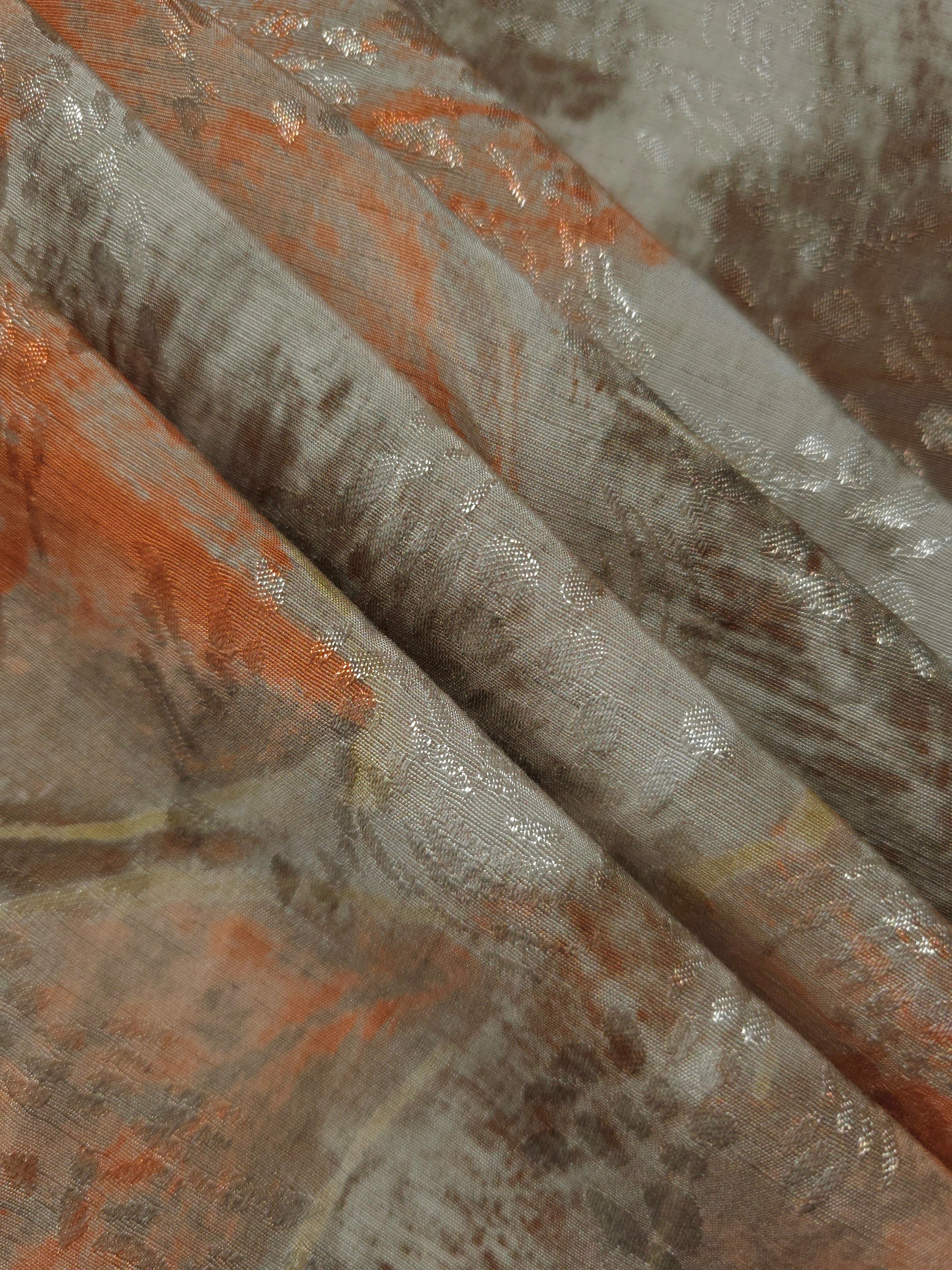Reverse side of orange botanical shadow jacquard fabric showing woven structure and linen-look finish.
