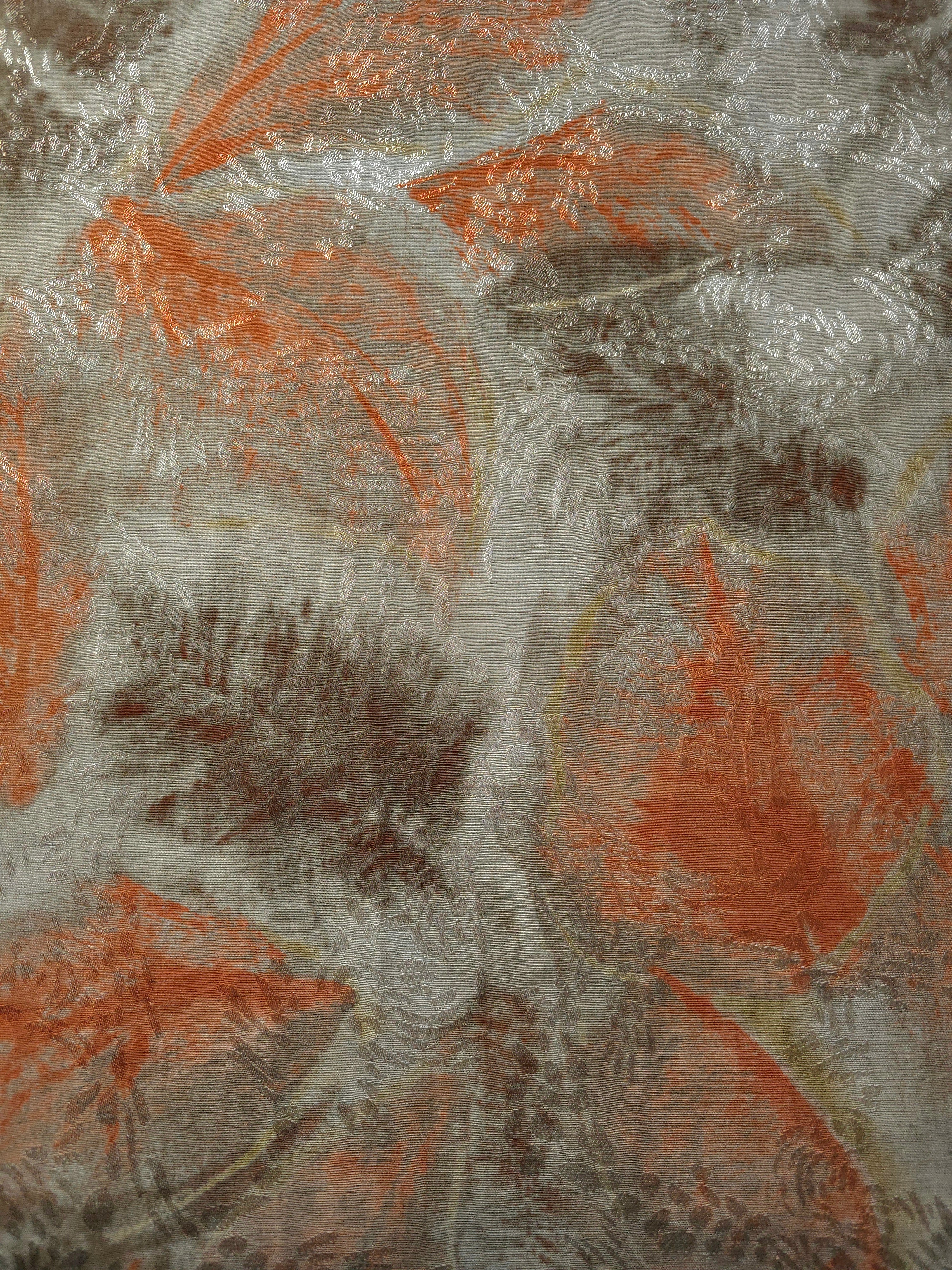 Texture view of orange botanical shadow linen-look jacquard fabric with raised tonal botanical motif.