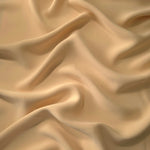 Camel Beige polyester crepe in long draped folds, showing flowing coverage for abayas and modest fashion
