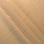 Camel Beige Korean crepe in layered folds, showing soft structure and slight mechanical stretch for skirts