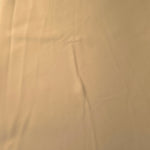 Flat view of Camel Beige Korean polyester crepe, 205 GSM opaque dressmaking fabric with a smooth woven surface