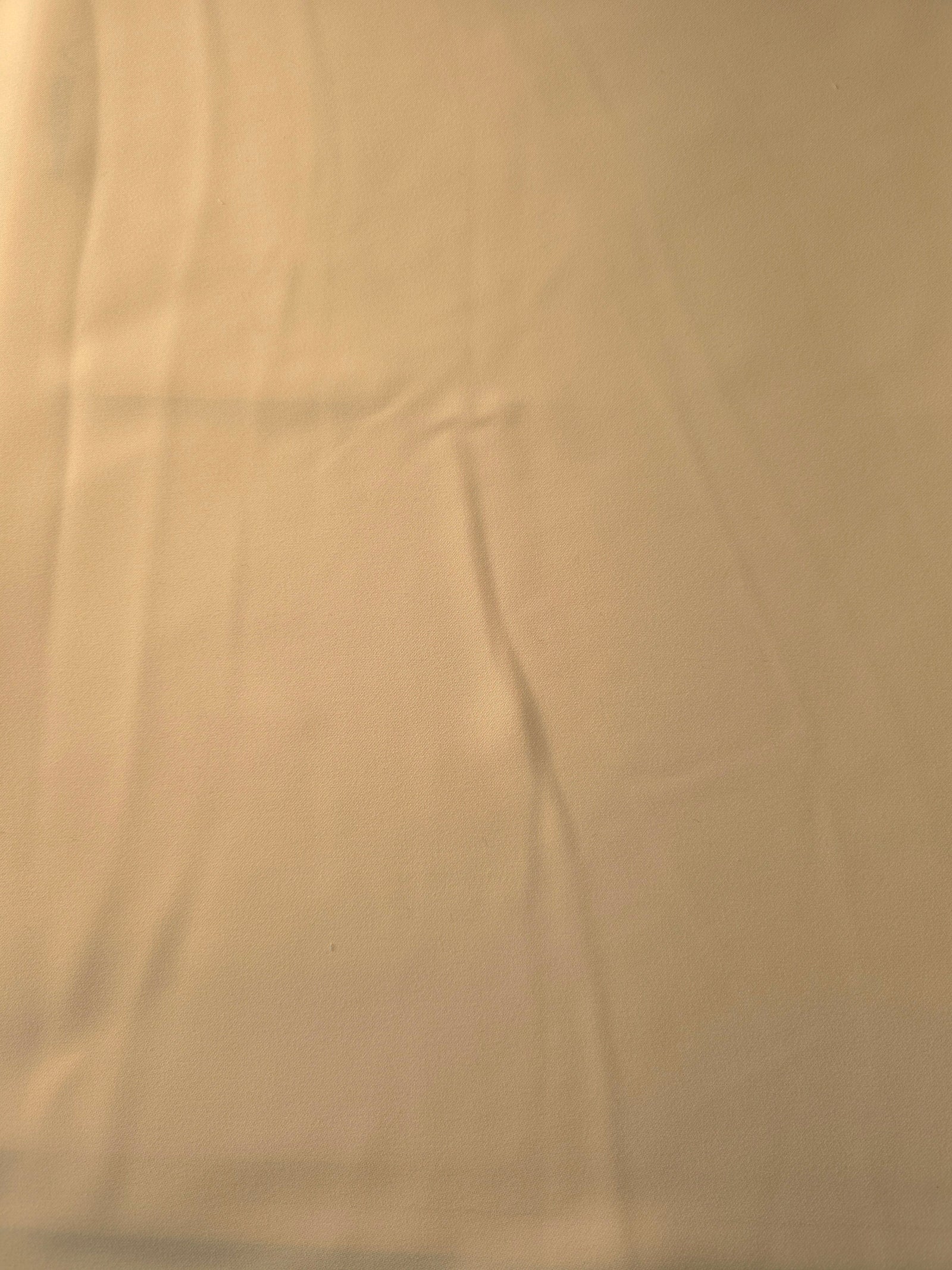 Flat view of Camel Beige Korean polyester crepe, 205 GSM opaque dressmaking fabric with a smooth woven surface