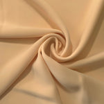 Swirled Camel Beige Korean crepe showing fluid movement and silky drape for dresses and occasionwear