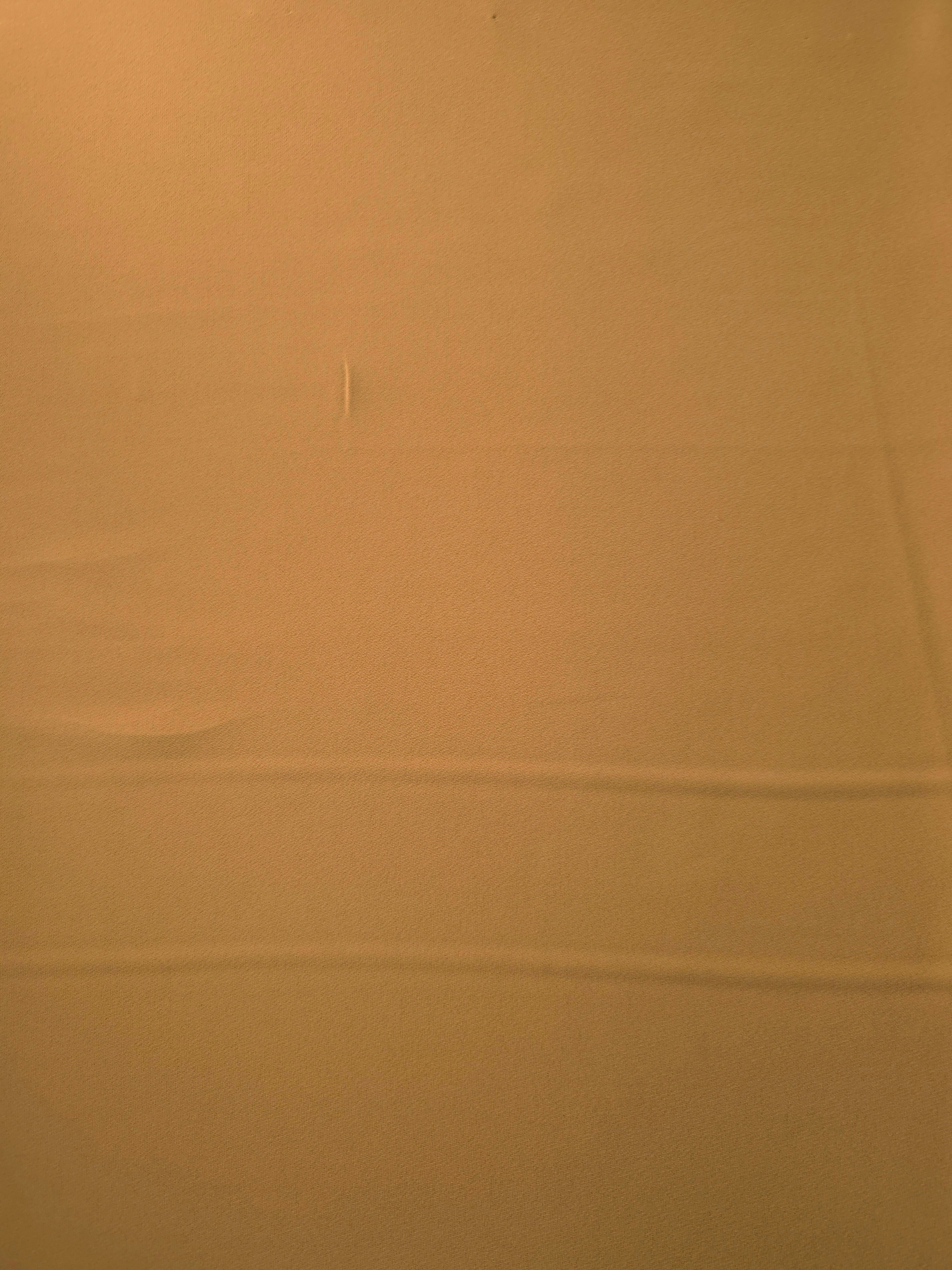 Caramel Brown Italian polyester crepe shown flat, smooth woven apparel fabric with a soft silky-feel finish
