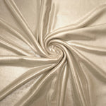 Champagne Beige foiled spandex styled in a swirl, revealing metallic shine and flexible drape for dance costumes and occasion looks