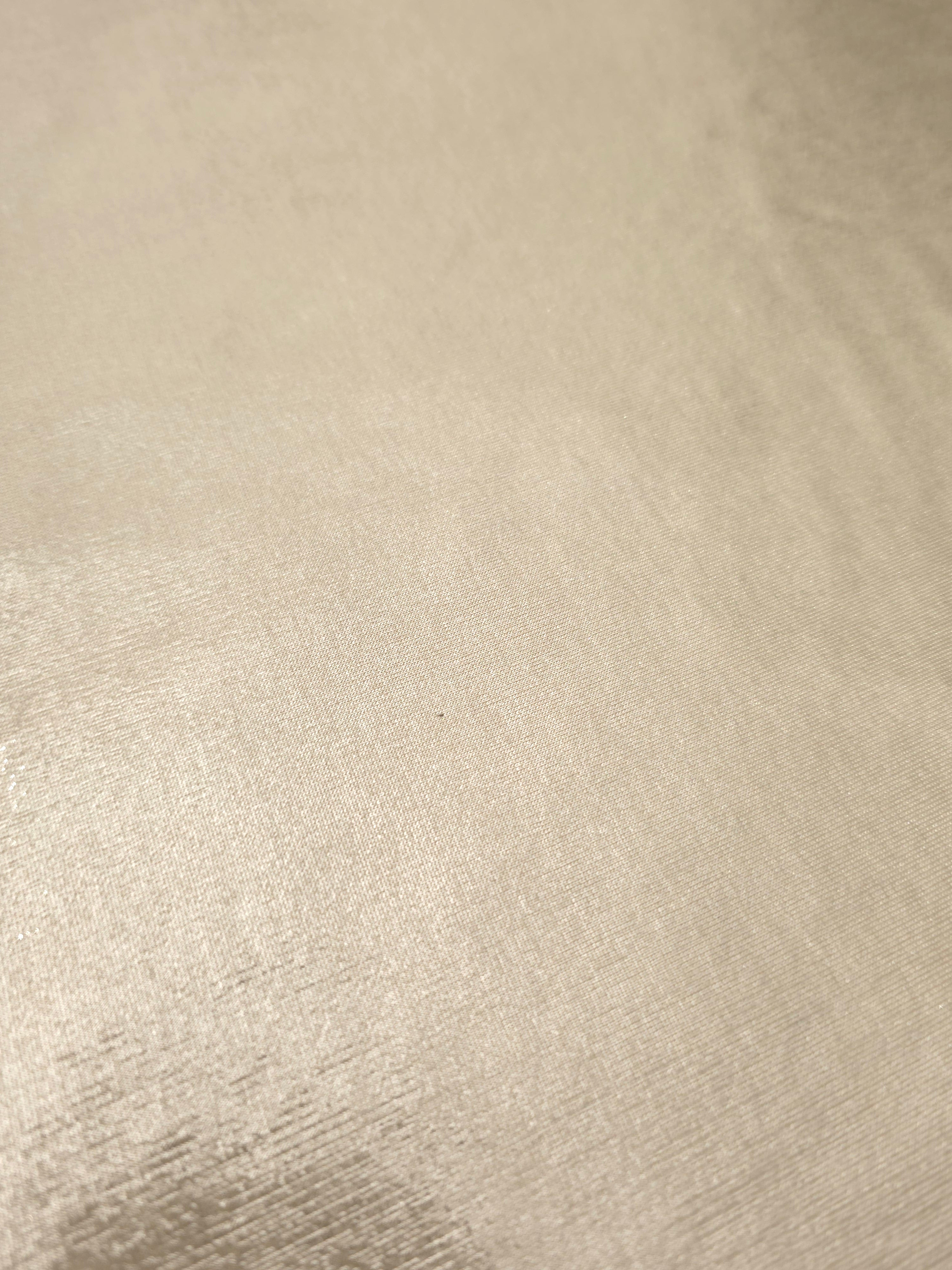 Close-up Champagne Beige shimmer metallic spandex showing reflective foil detail and the fabric surface for statement garments