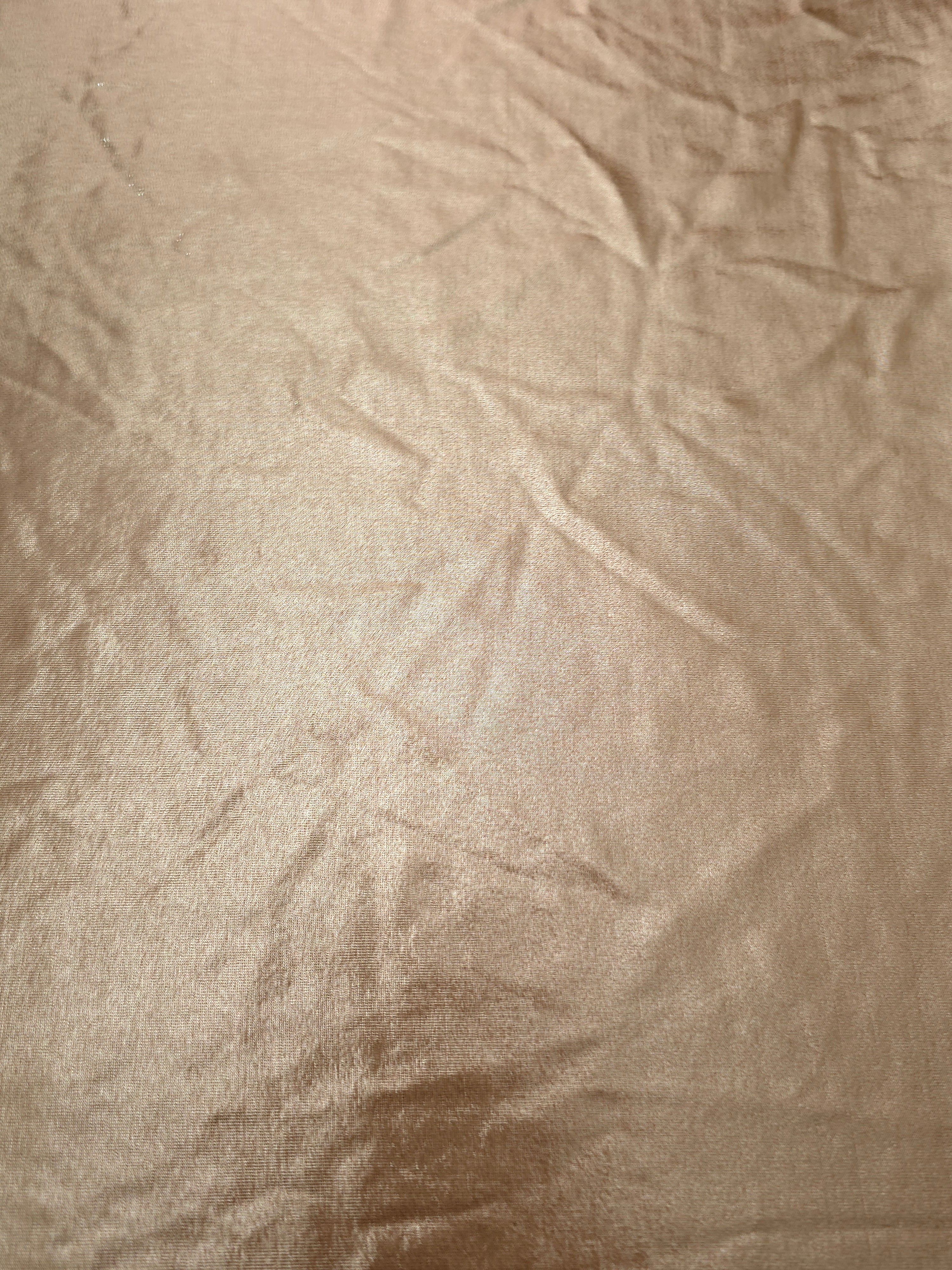 Flat Champagne Taupe foiled stretch fabric with bright metallic reflection, ideal for performancewear, evening pieces and creative sewing