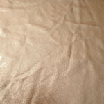 Champagne Taupe foiled stretch fabric texture close-up, displaying metallic reflection and fine surface character for apparel design