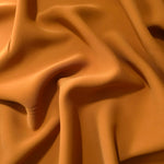 Long draped folds of Cinnamon Brown Korean crepe showing opaque coverage for abayas, dresses and modest wear