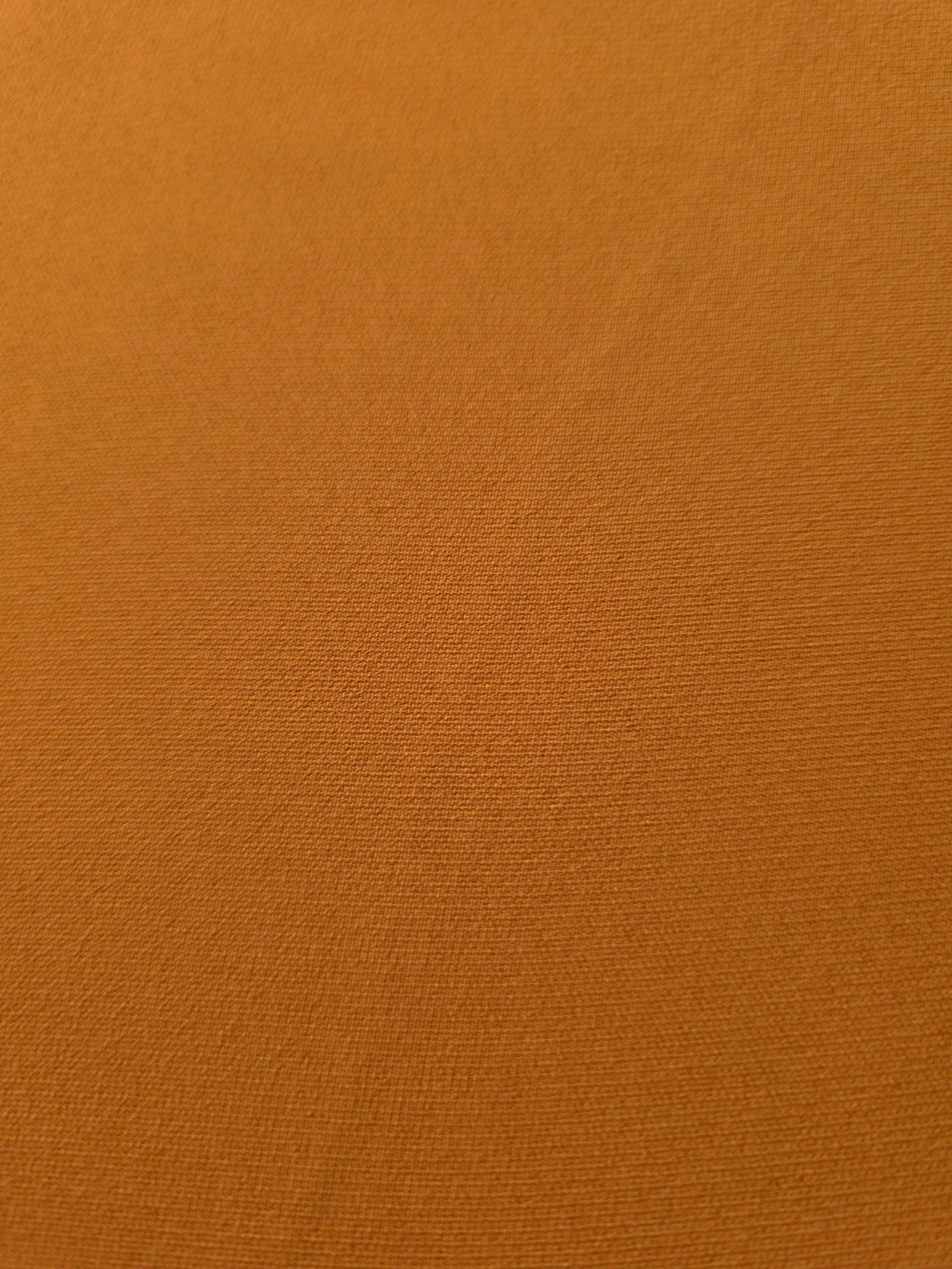 Fine texture close-up of Cinnamon Brown 100% mechanical polyester crepe showing a smooth, silky-soft woven hand
