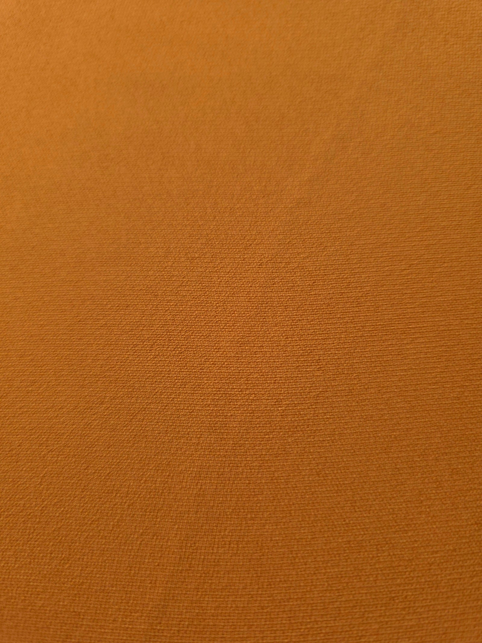 Fine texture close-up of Cinnamon Brown 100% mechanical polyester crepe showing a smooth, silky-soft woven hand