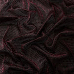 Draped Burgundy Red Sheer Circle Shimmer Stretch Tulle Fabric showing reflective round motifs across soft fluid folds