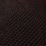 Surface detail of Burgundy Red Sheer Circle Shimmer Stretch Tulle Fabric highlighting reflective circle scale and lightweight tulle texture