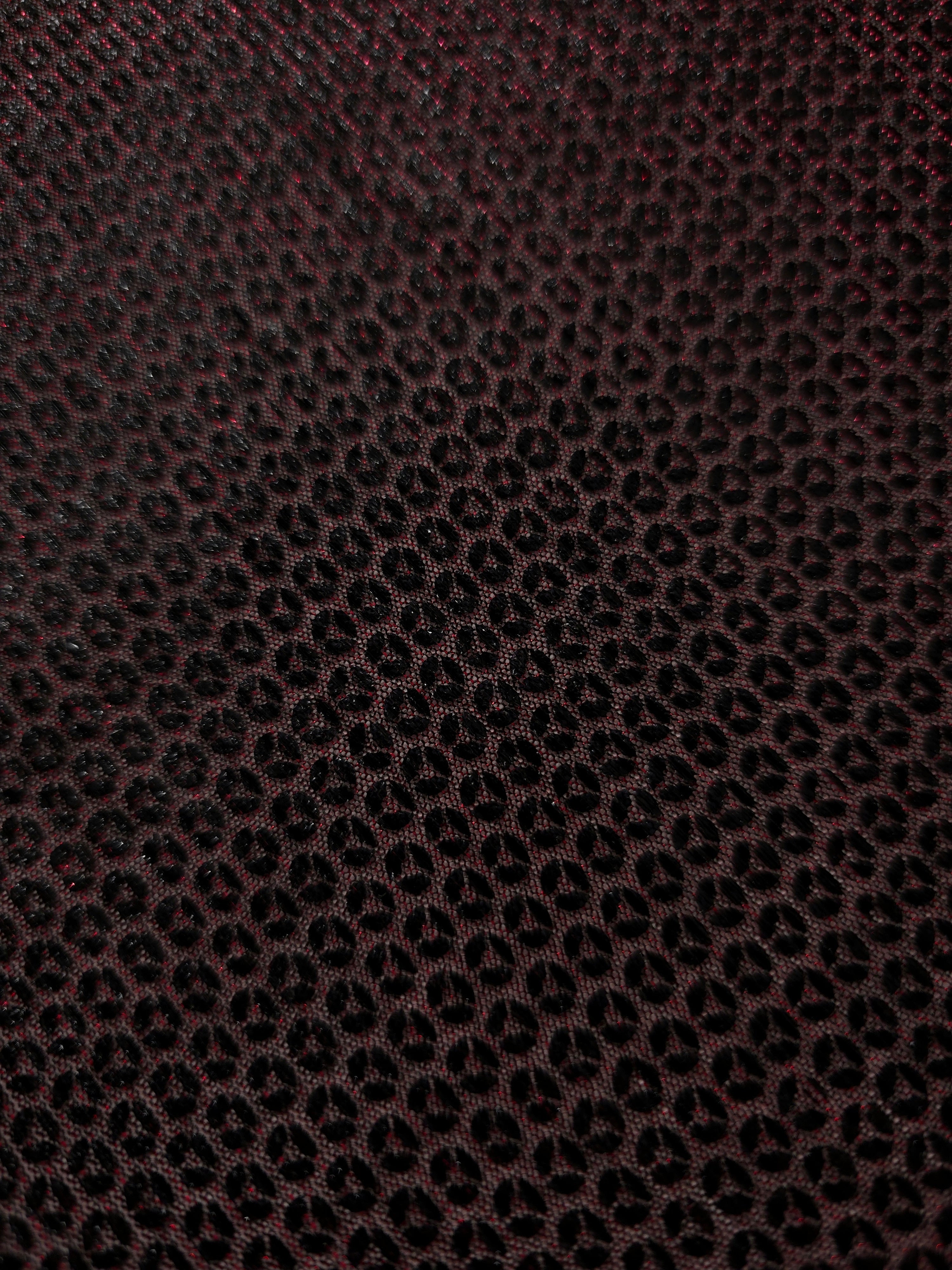 Surface detail of Burgundy Red Sheer Circle Shimmer Stretch Tulle Fabric highlighting reflective circle scale and lightweight tulle texture