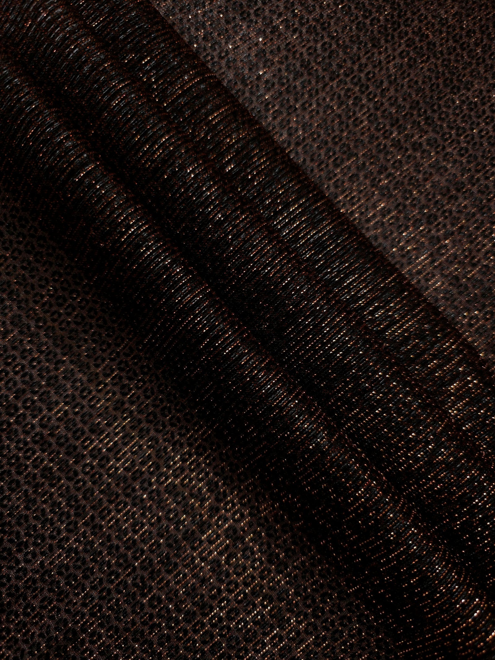 Layered Burnt Copper Sheer Circle Shimmer Stretch Tulle Fabric showing overlapping circles, luminous depth and airy transparency