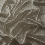 Draped Champagne Gold Sheer Circle Shimmer Stretch Tulle Fabric showing reflective round motifs across soft fluid folds