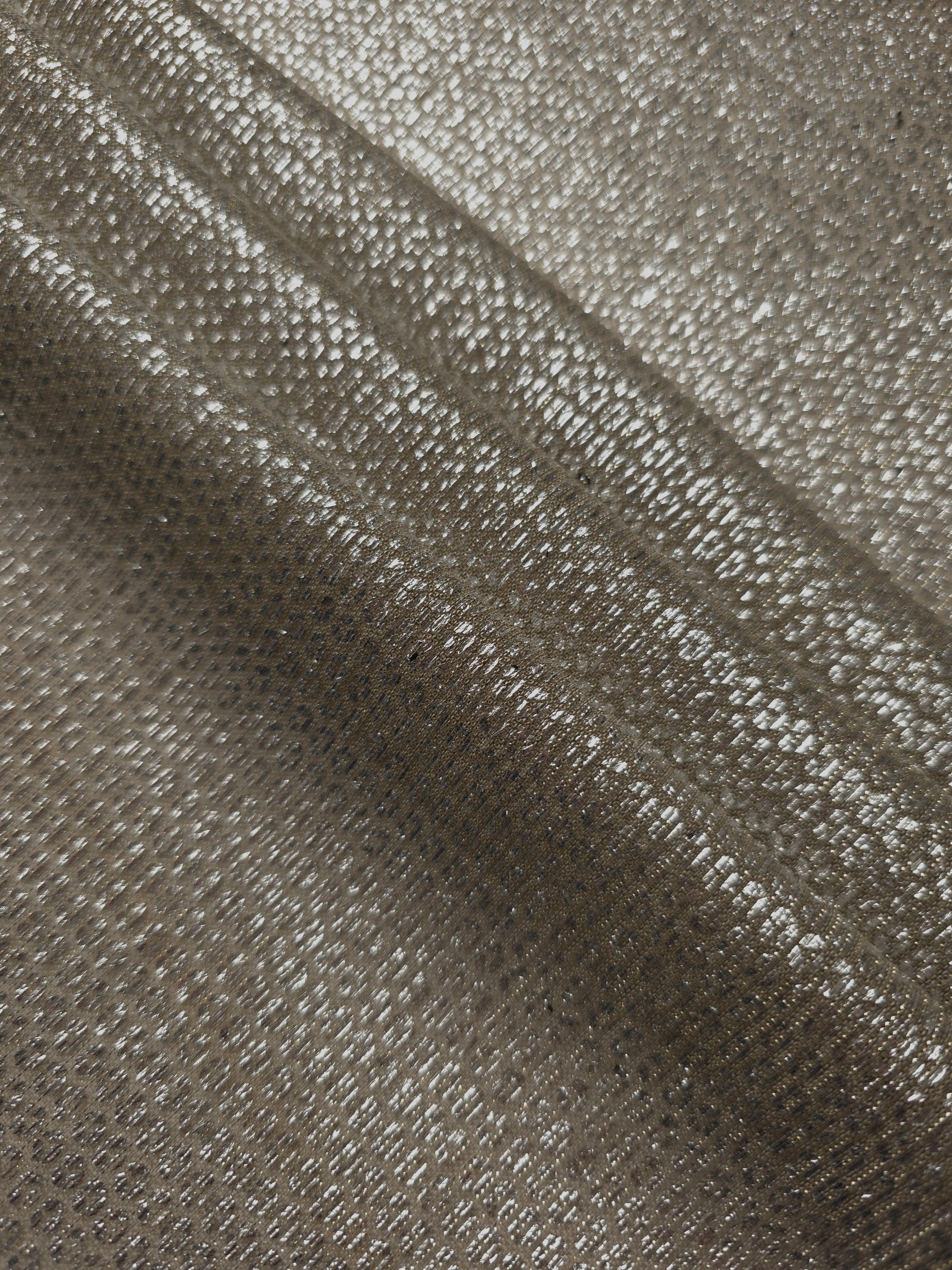 Layered Champagne Gold Sheer Circle Shimmer Stretch Tulle Fabric showing overlapping circles, luminous depth and airy transparency