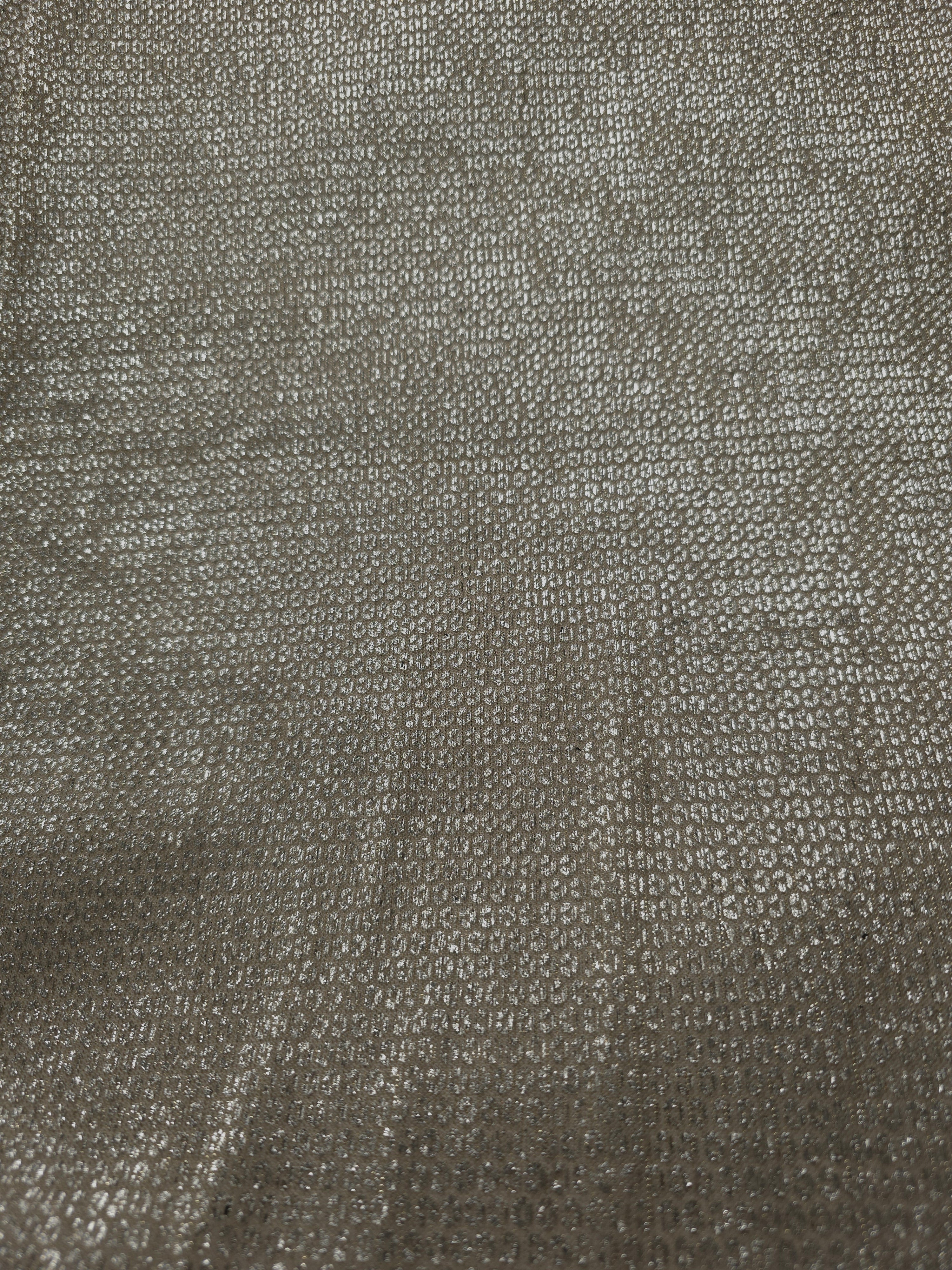 Surface detail of Champagne Gold Sheer Circle Shimmer Stretch Tulle Fabric highlighting reflective circle scale and lightweight tulle texture