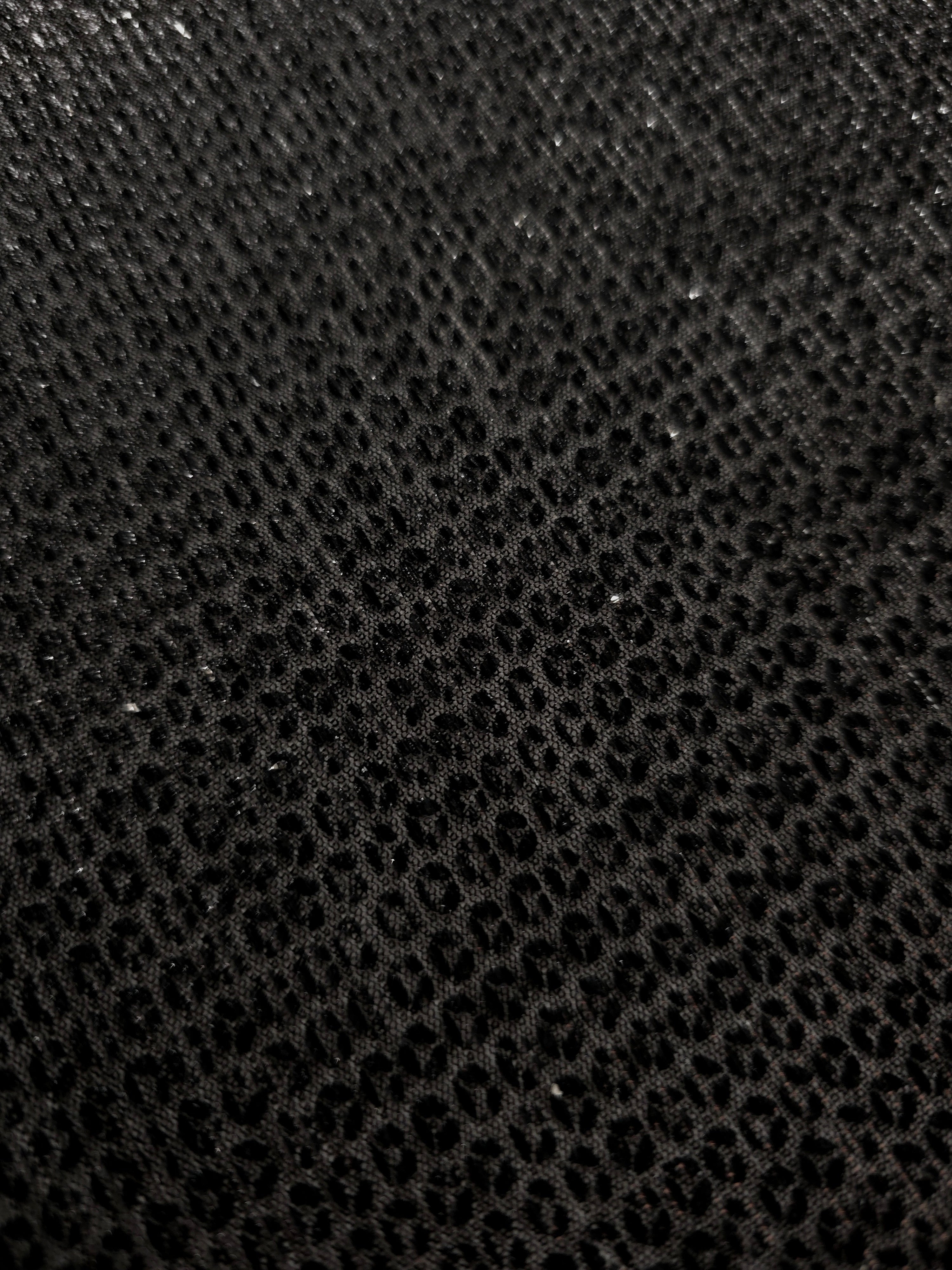 Surface detail of Charcoal Silver Sheer Circle Shimmer Stretch Tulle Fabric highlighting reflective circle scale and lightweight tulle texture