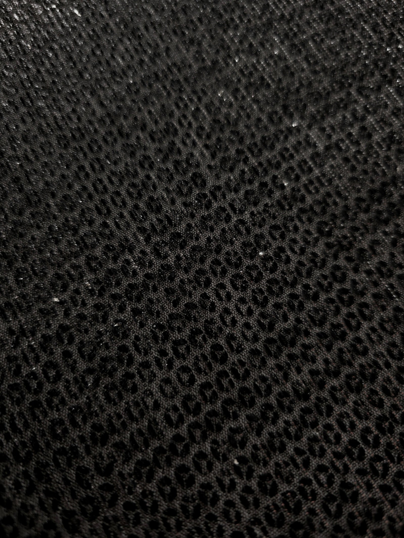 Surface detail of Charcoal Silver Sheer Circle Shimmer Stretch Tulle Fabric highlighting reflective circle scale and lightweight tulle texture