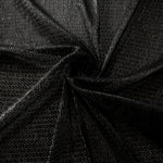 Swirl-draped Charcoal Silver Sheer Circle Shimmer Stretch Tulle Fabric showing circular highlights shifting through flexible movement