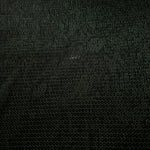 Surface detail of Deep Emerald Sheer Circle Shimmer Stretch Tulle Fabric highlighting reflective circle scale and lightweight tulle texture