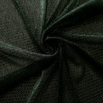 Swirl-draped Deep Emerald Sheer Circle Shimmer Stretch Tulle Fabric showing circular highlights shifting through flexible movement