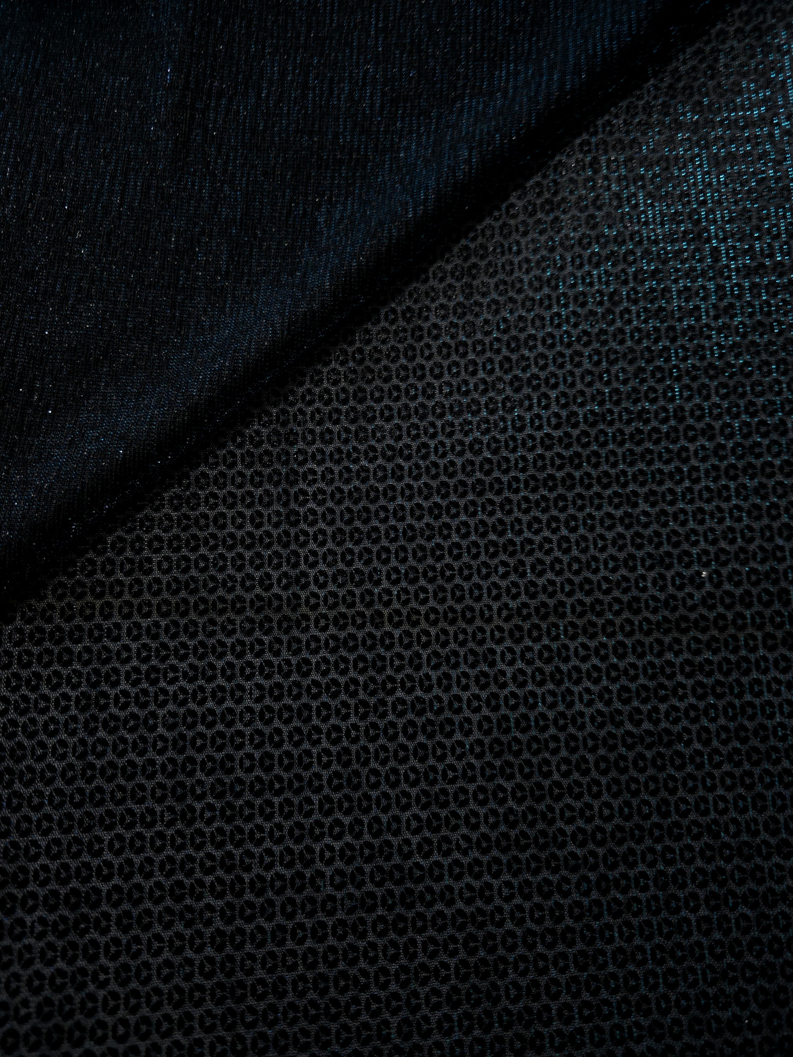 Close-up of Deep Teal Sheer Circle Shimmer Stretch Tulle Fabric revealing the circular shimmer repeat and fine sheer mesh
