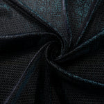 Draped Deep Teal Sheer Circle Shimmer Stretch Tulle Fabric showing reflective round motifs across soft fluid folds