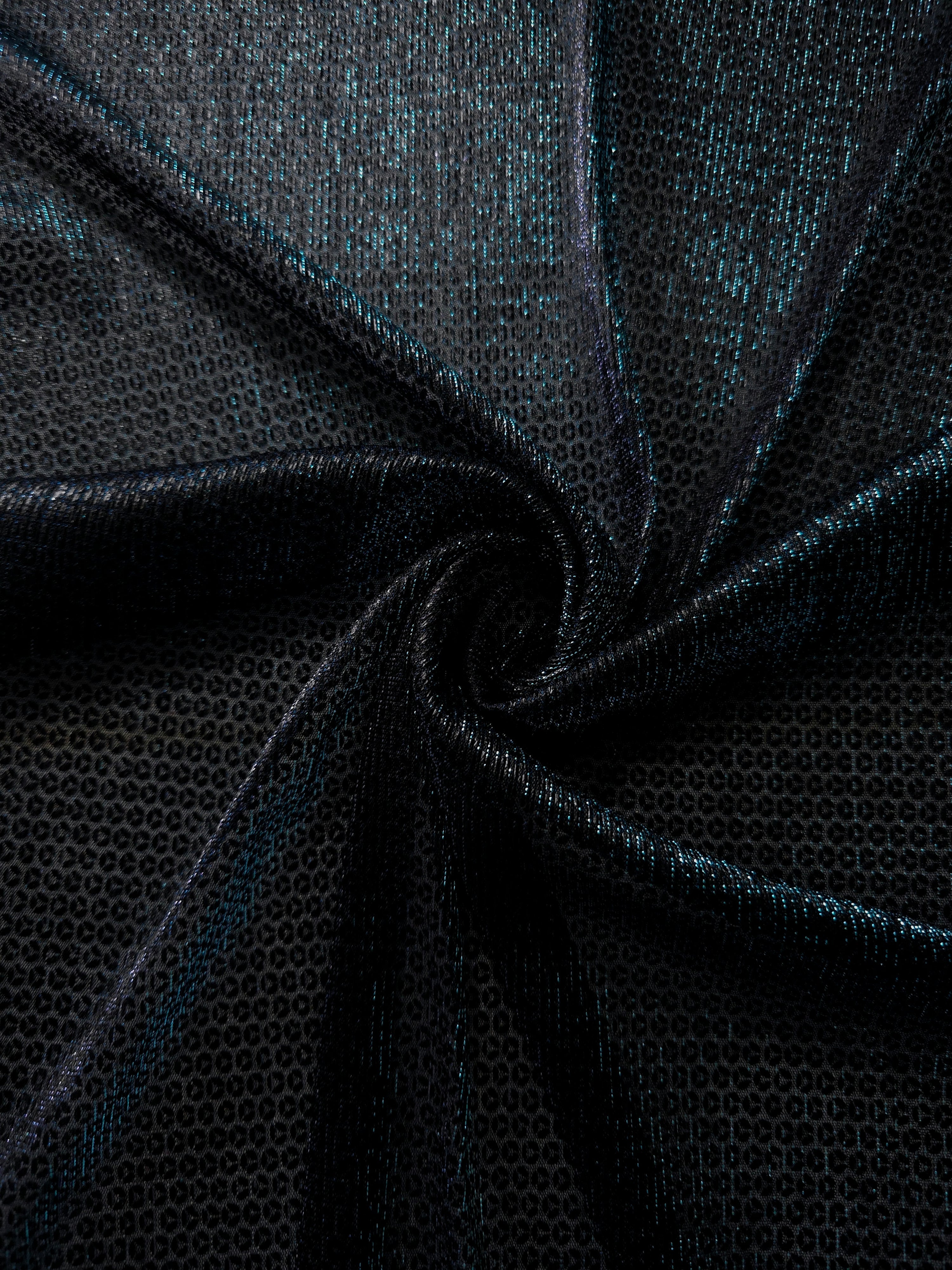 Draped Deep Teal Sheer Circle Shimmer Stretch Tulle Fabric showing reflective round motifs across soft fluid folds