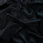 Front and back of Deep Teal Sheer Circle Shimmer Stretch Tulle Fabric showing transparent knit structure, circle motif and stretch