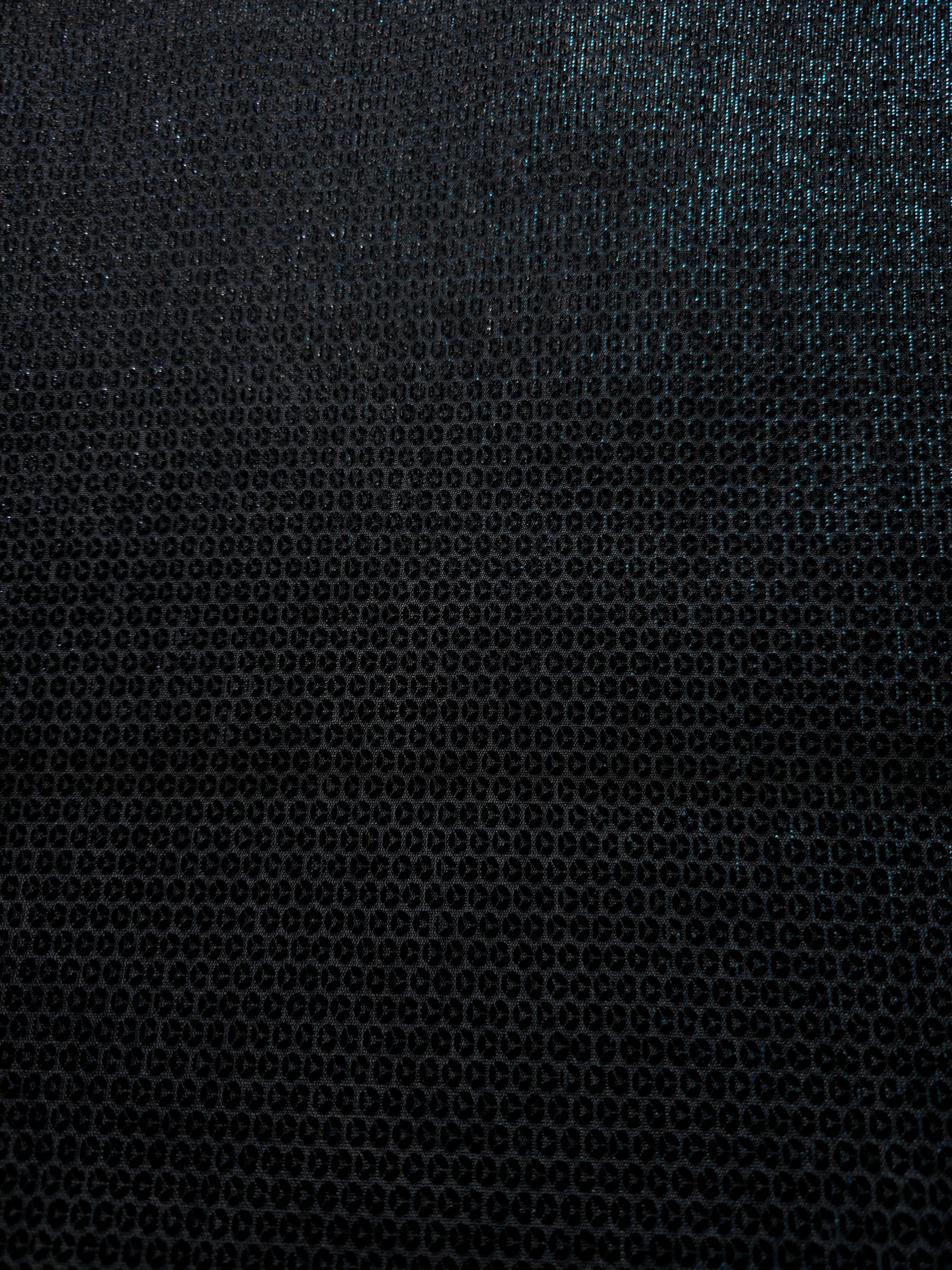 Layered Deep Teal Sheer Circle Shimmer Stretch Tulle Fabric showing overlapping circles, luminous depth and airy transparency