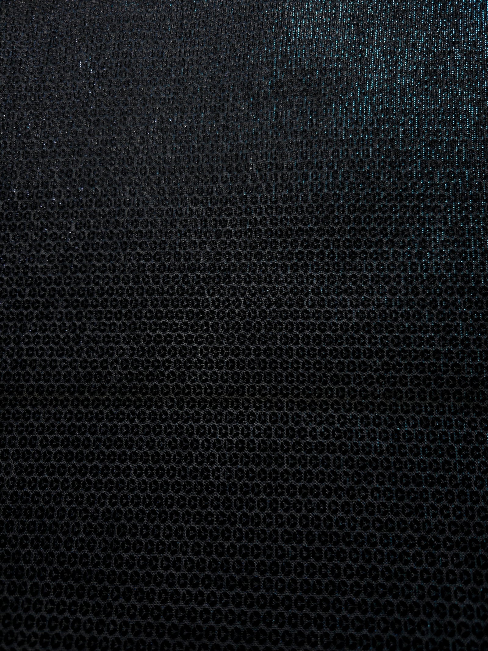 Layered Deep Teal Sheer Circle Shimmer Stretch Tulle Fabric showing overlapping circles, luminous depth and airy transparency
