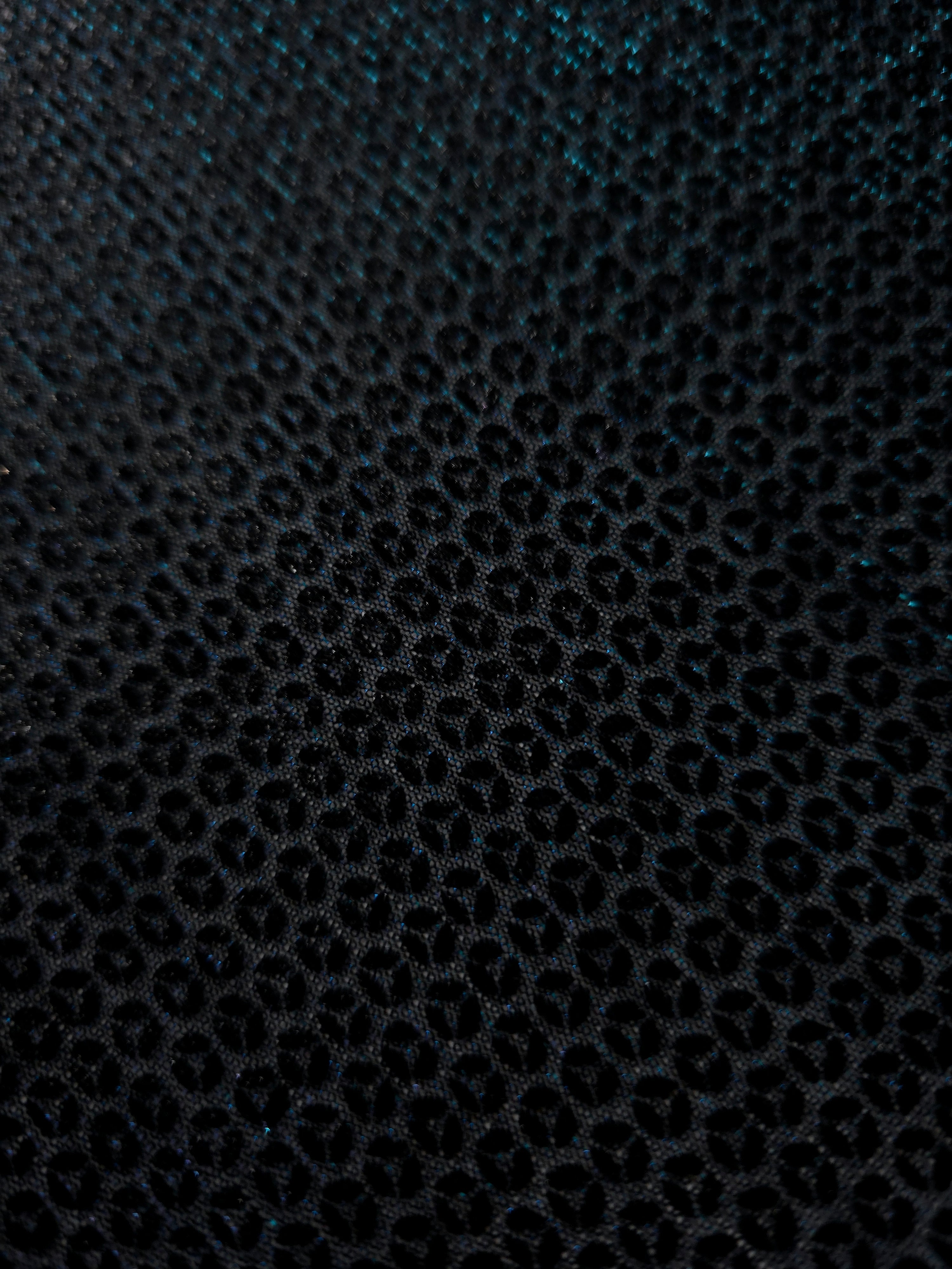 Surface detail of Deep Teal Sheer Circle Shimmer Stretch Tulle Fabric highlighting reflective circle scale and lightweight tulle texture