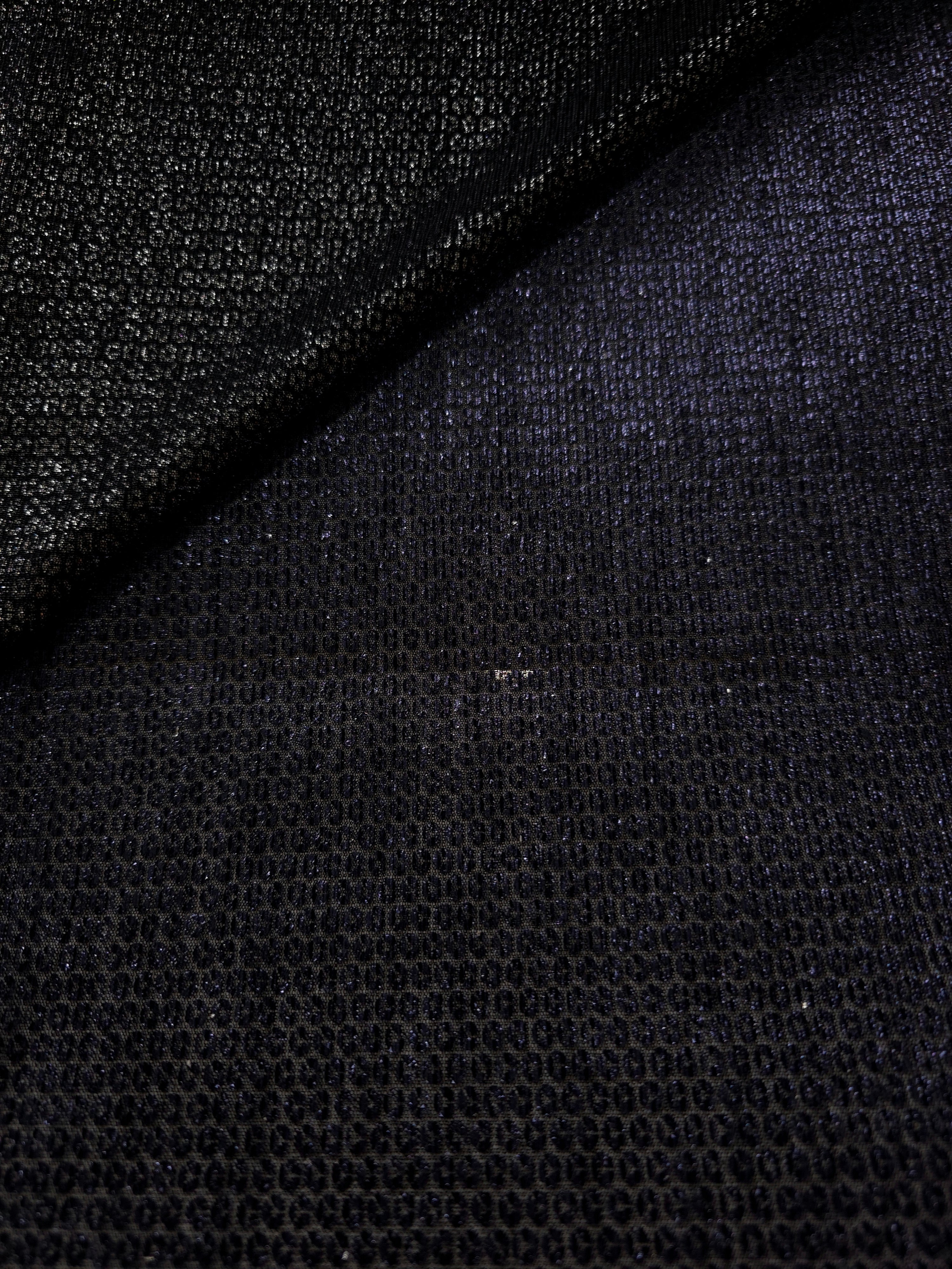 Close-up of Midnight Indigo Sheer Circle Shimmer Stretch Tulle Fabric revealing the circular shimmer repeat and fine sheer mesh