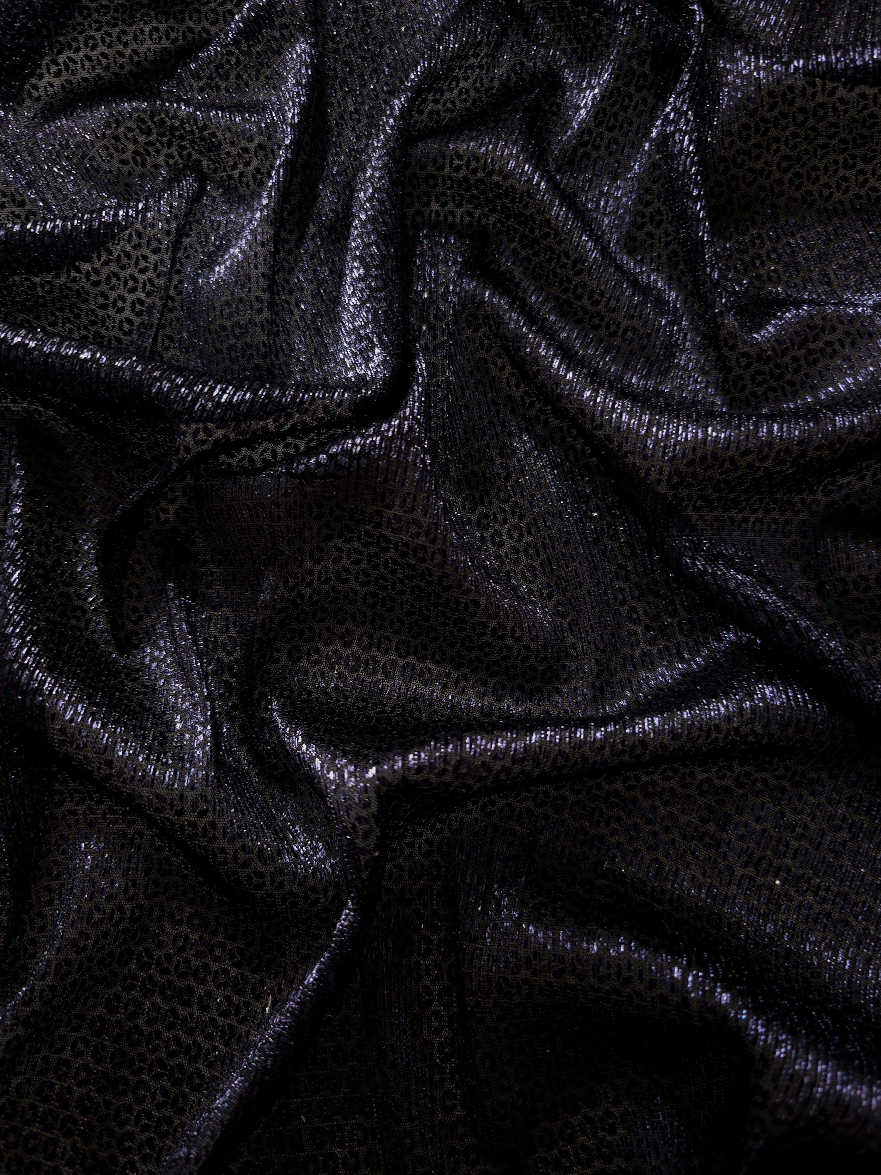 Front and back of Midnight Indigo Sheer Circle Shimmer Stretch Tulle Fabric showing transparent knit structure, circle motif and stretch