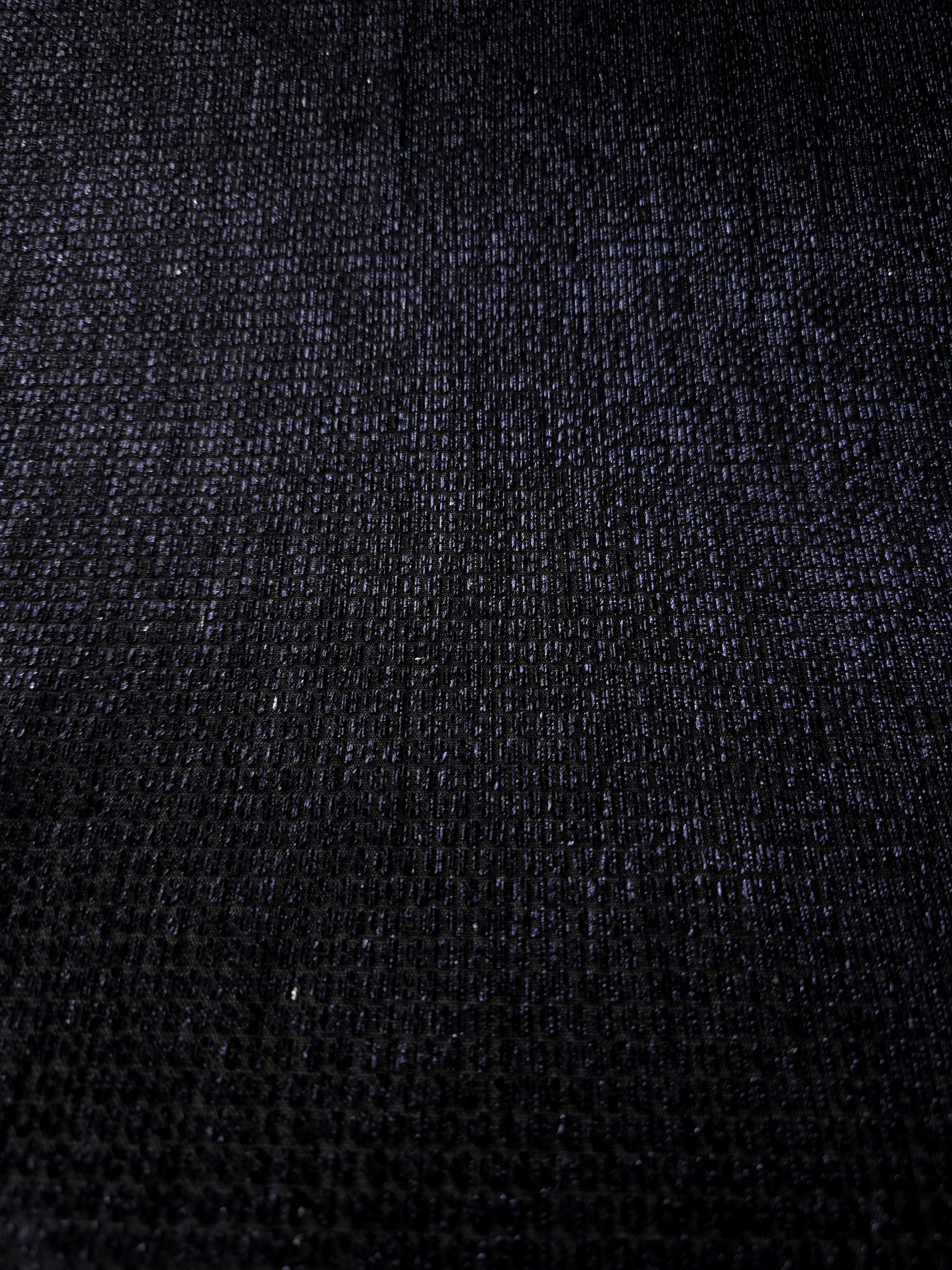 Layered Midnight Indigo Sheer Circle Shimmer Stretch Tulle Fabric showing overlapping circles, luminous depth and airy transparency