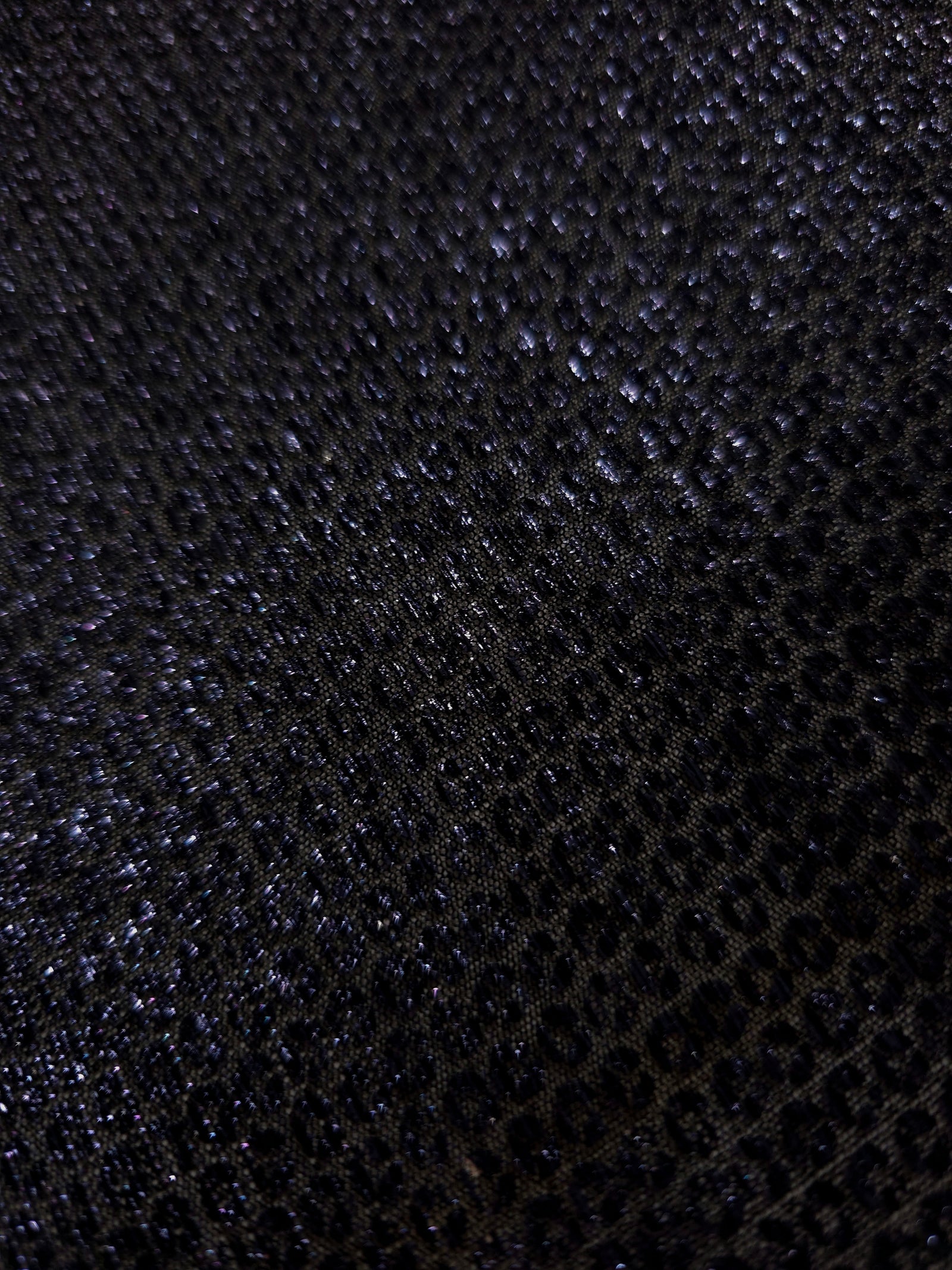 Surface detail of Midnight Indigo Sheer Circle Shimmer Stretch Tulle Fabric highlighting reflective circle scale and lightweight tulle texture