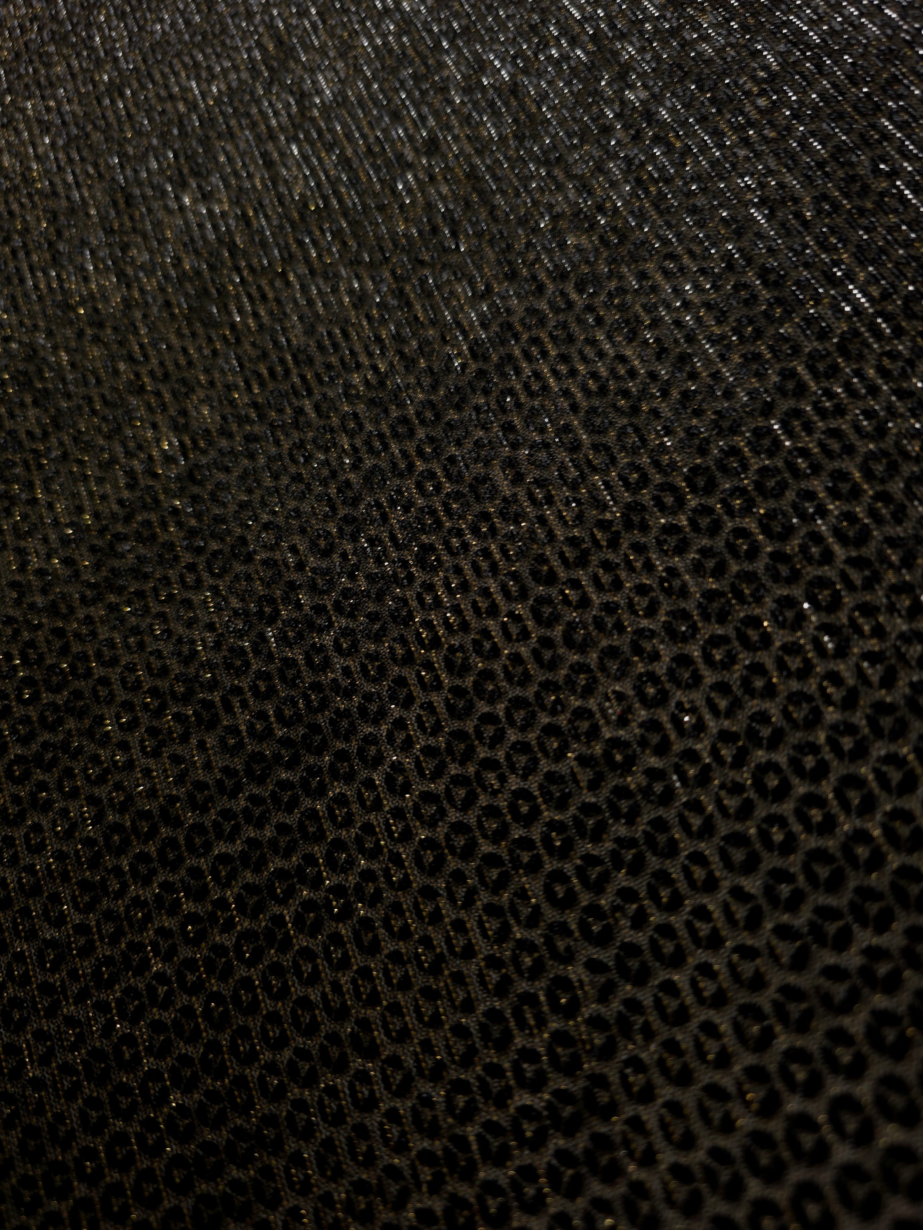 Close-up of Olive Gold Sheer Circle Shimmer Stretch Tulle Fabric revealing the circular shimmer repeat and fine sheer mesh